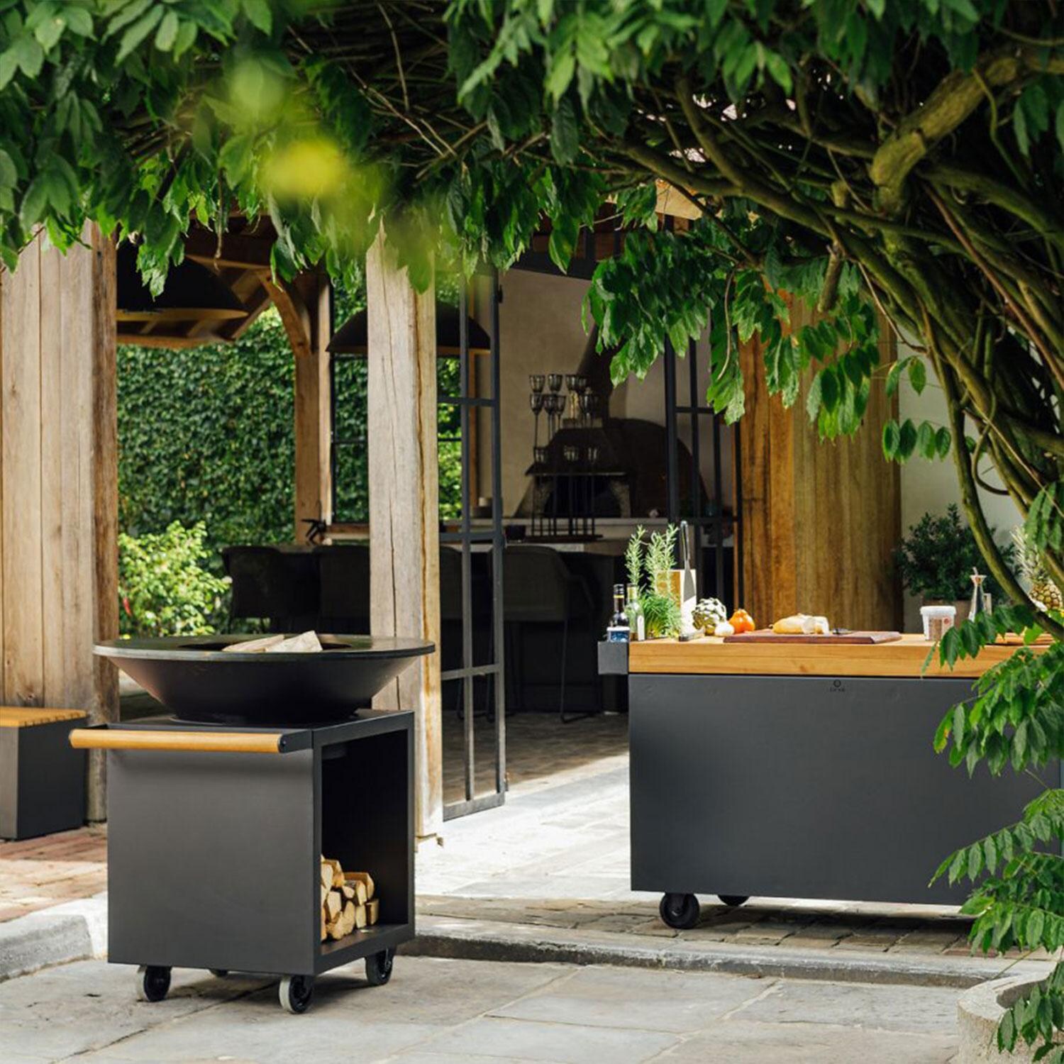 OFYR OCSB-100-PRO Classic Storage Black 100 PRO 40 Inch Wood-Fired Flat Top Grill - Back Patio - Styled w/ Food Prep Station (Not Included) - Lifestyle thumbnail