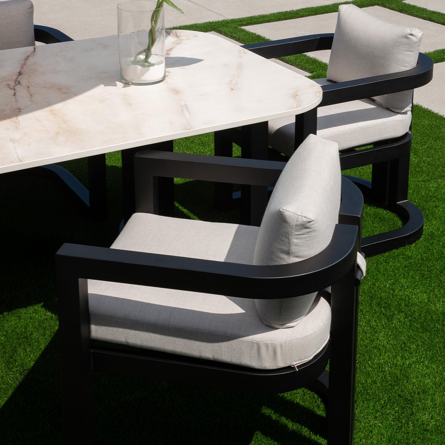 Malibu Aluminum Dining Arm Chair in Black/Soothe Pearl by Sunset West - By the Pool - Lifestyle thumbnail