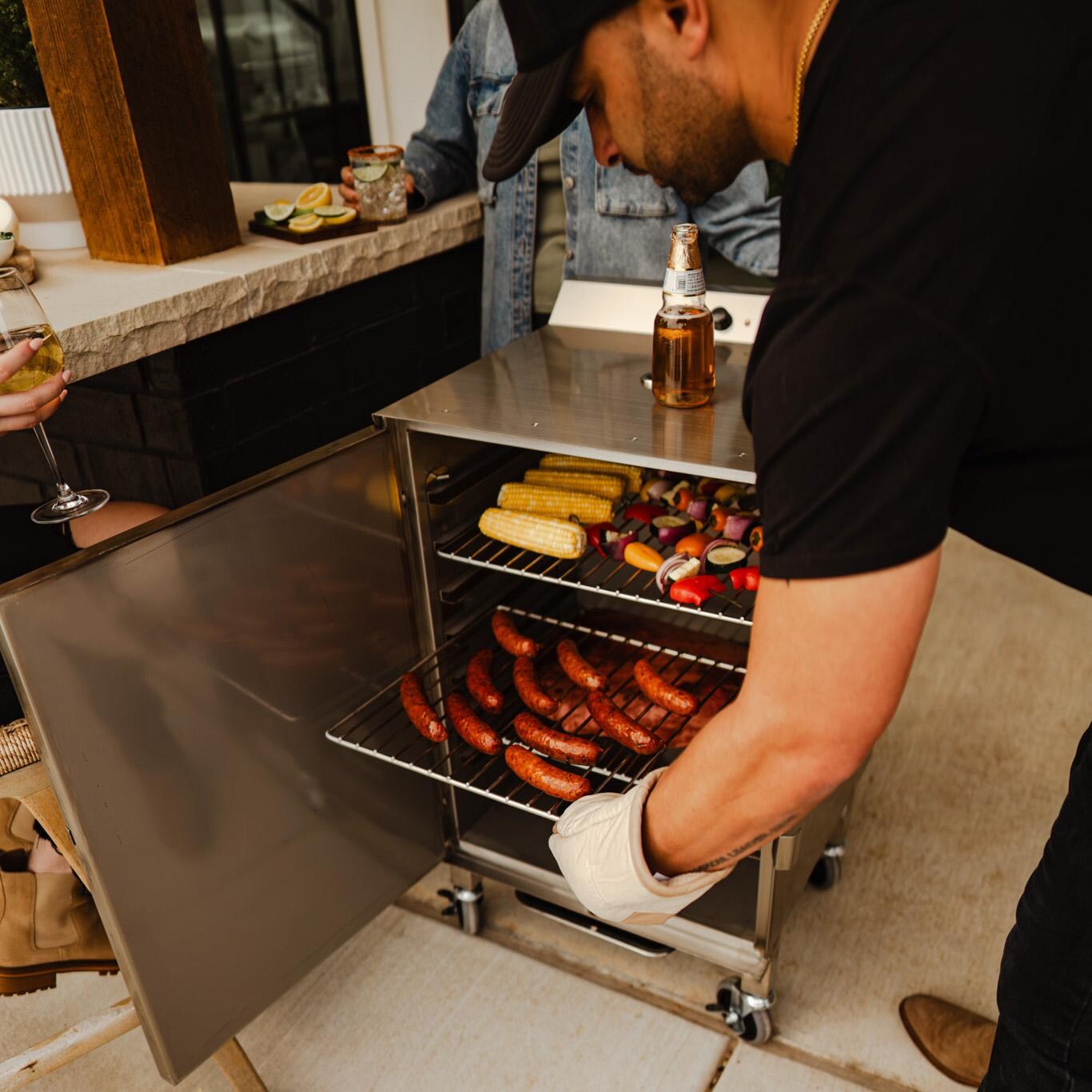 Smokin Tex 1500 The XL Legacy Series Electric Smoker - Removing Rack from Smoker - Lifestyle thumbnail