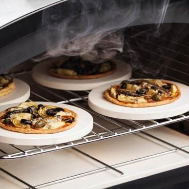 Fornetto 8 Inch Round Mini Pizza Stone - Set Of 4 - In Oven thumbnail