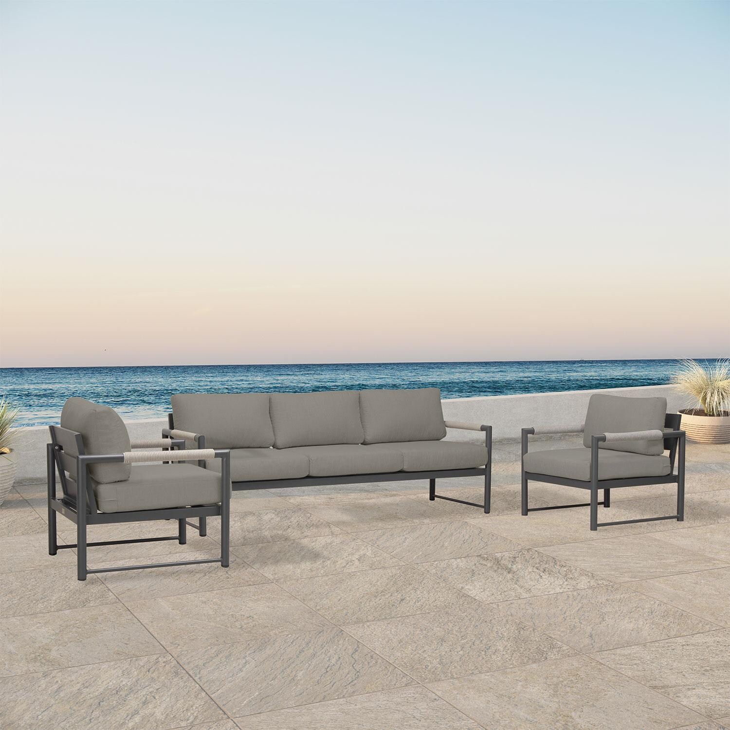 Lakeview AVEBAY-SL-PG-SET141-CC Avenue Bay Slate/Pebble Gray Sofa Club Chair Set - Canvas Charcoal - Angled On Patio - Lifestyle thumbnail