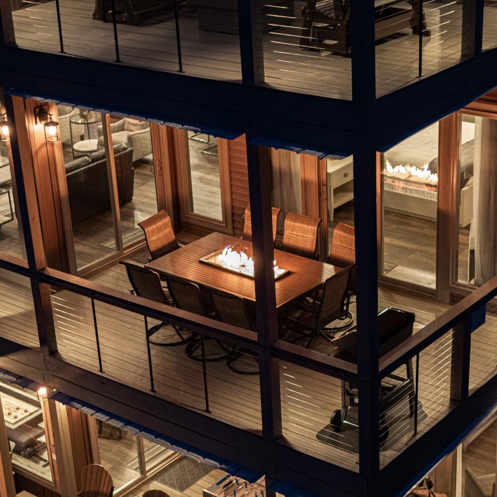 Lakeview Outdoor Designs Revere 80-Inch Linear Natural Gas Fire Pit Dining Table with 42-Inch Crystal Fire Burner - Ships As Propane With Conversion Fittings - At Night - Lifestyle thumbnail