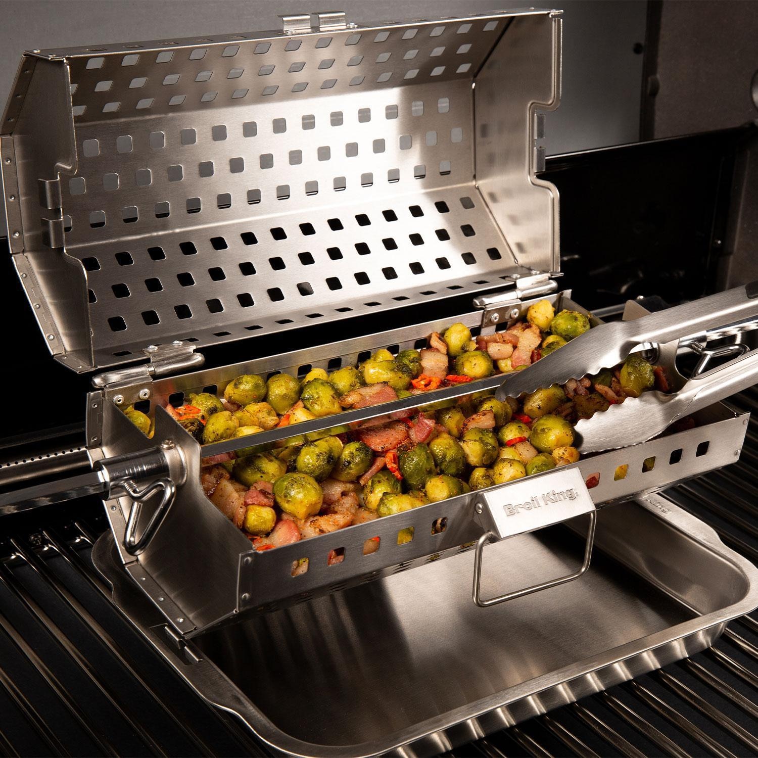 Broil King 64875 Rotisserie Tumble Basket - Mixing Veggies Around in Basket - Lifestyle thumbnail