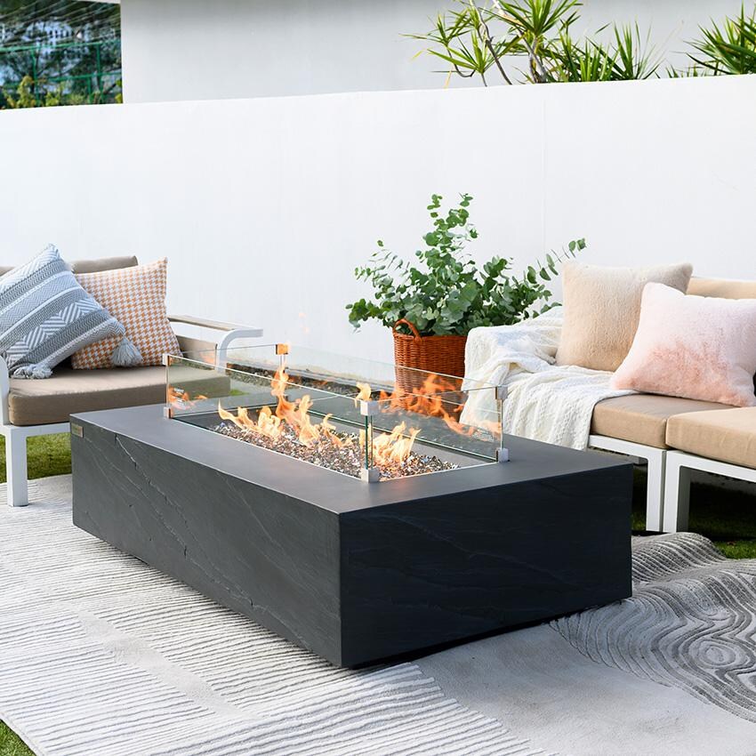 Elementi Cape Town OFG410SL-NG 56-Inch Natural Gas Slate Black Fire Pit Table - Angled and Lit With Wind Screen (Sold Separately) thumbnail
