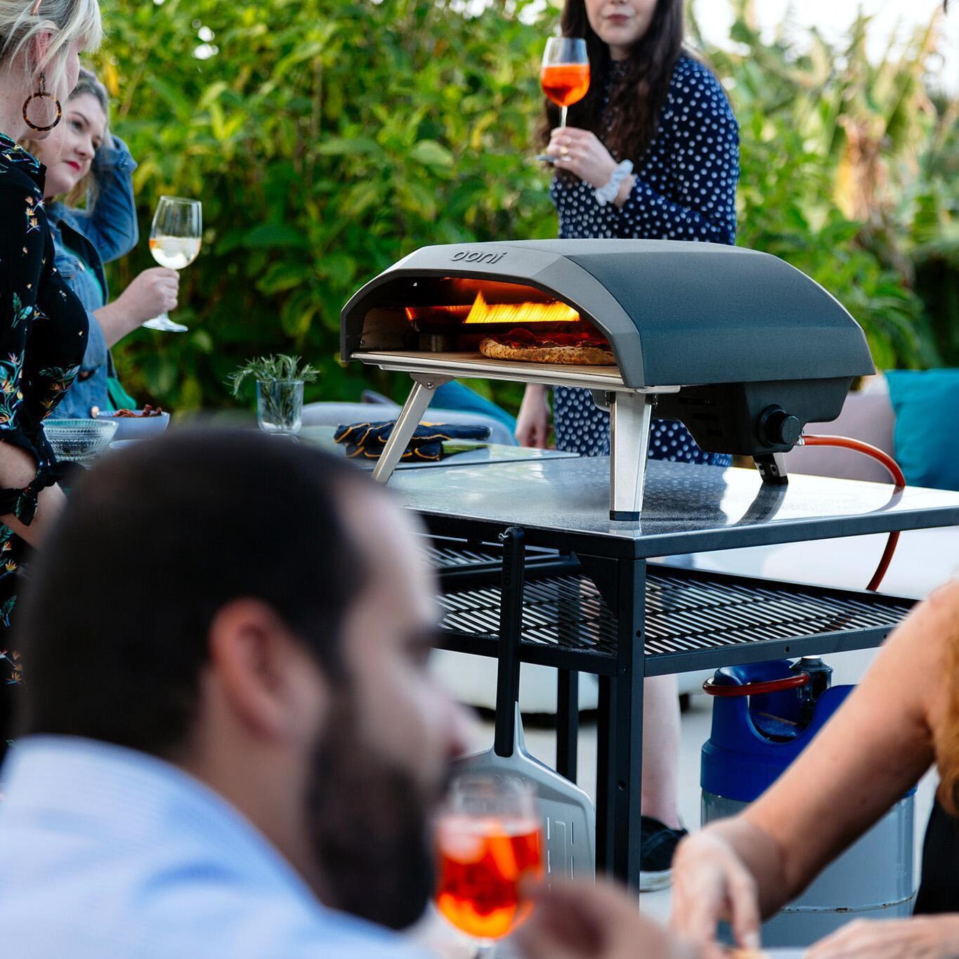 Ooni - UU-P0AB00 - Koda 16 Gas Powered Portable Outdoor Pizza Oven - Pizza In Progress thumbnail