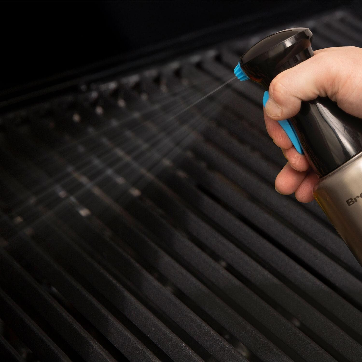 Broil King 60970 Stainless Steel Oil Sprayer Pump Bottle - Spraying Oil on Grill - Lifestyle thumbnail