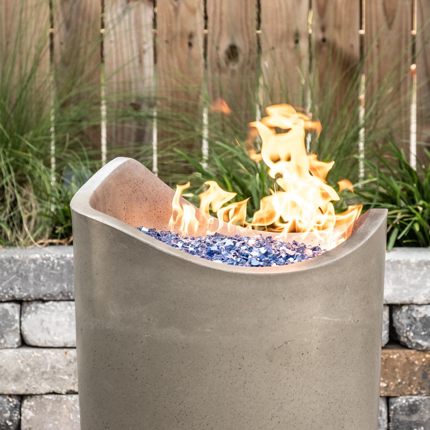 American Fyre Designs Wave 20-Inch Propane Gas Fire Urn - Smoke - Lifestyle - Shown with Alpine Flame Sky Blue Fire Glass (Sold Separately) thumbnail