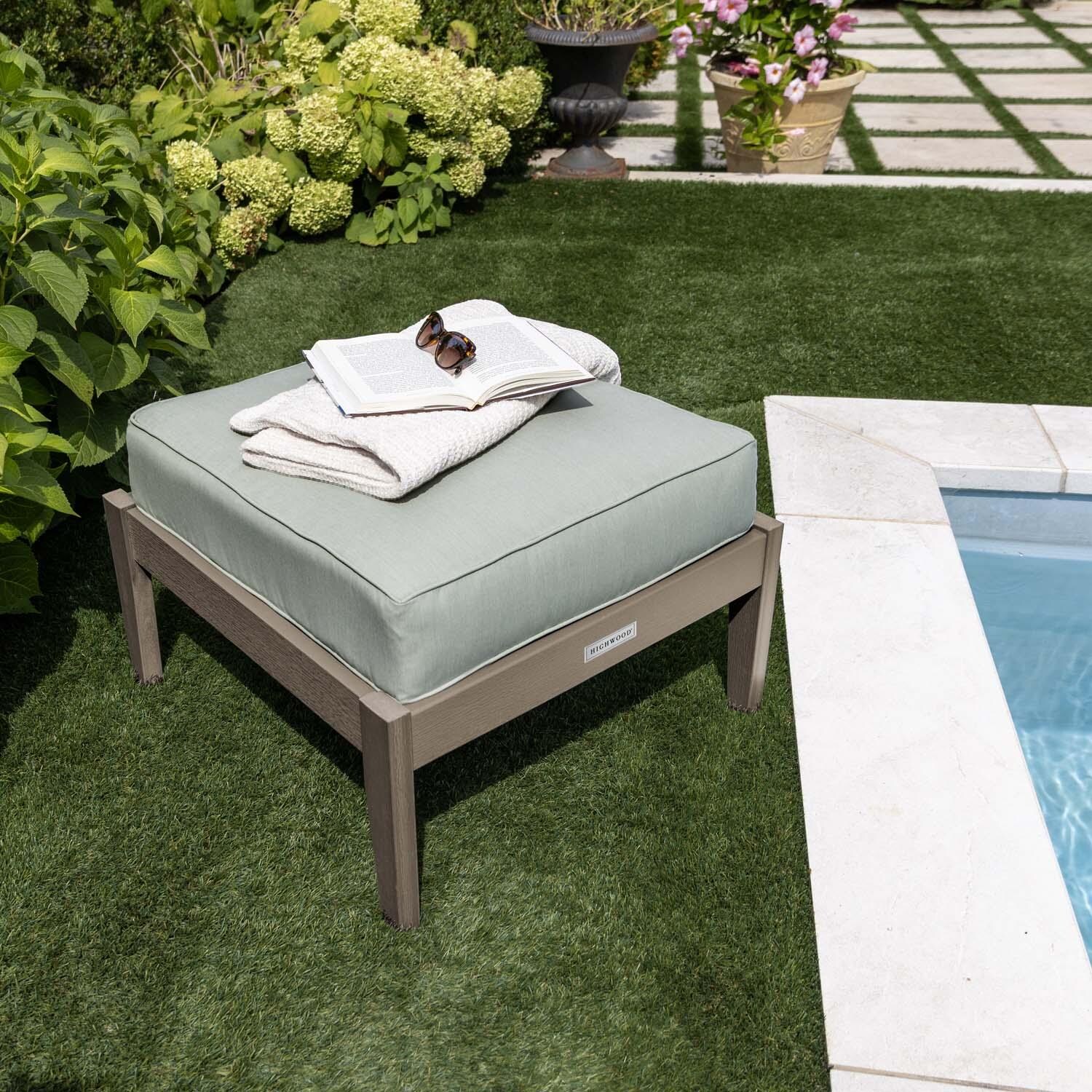 Blushing Bay Recycled Plastic Ottoman in Canvas Seasalt/Woodland Brown by Lakeview Outdoor Designs - By Pool Close Up - Lifestyle thumbnail