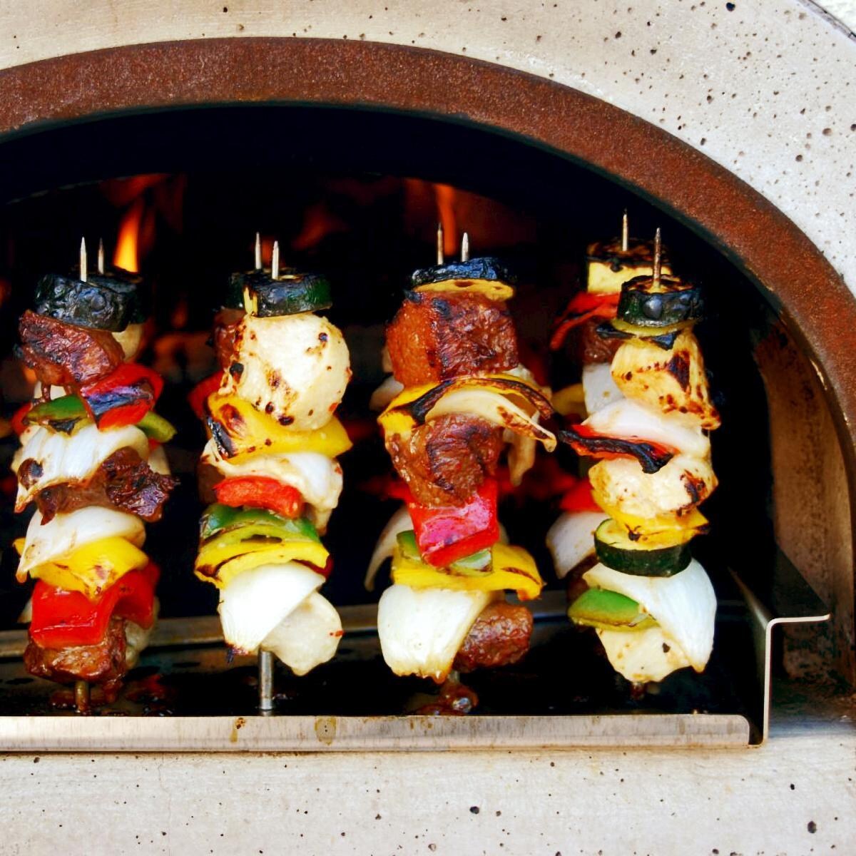 Chicago Brick Oven Wood Fired Pizza Ovens - Baking Shish Kabobs thumbnail