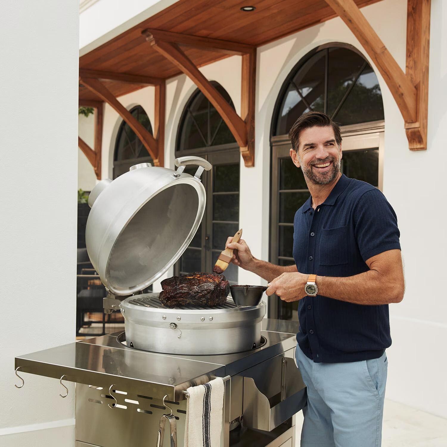 Blaze BLZ-20-KAMADO 20-Inch Cast Aluminum Kamado Grill on Stainless Steel Cart - Man Grilling - Lifestyle thumbnail