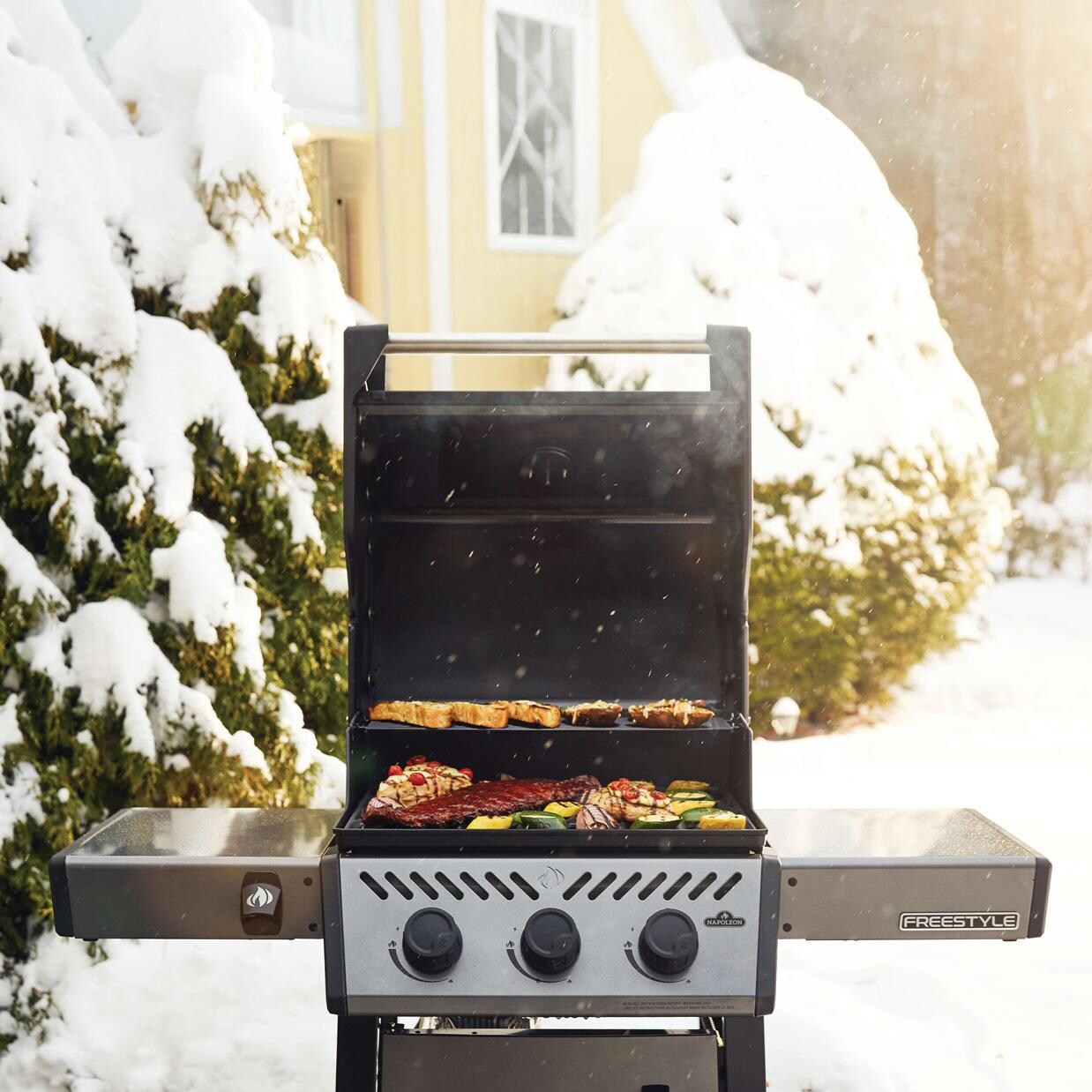 Napoleon F365DNGT Freestyle 365 3 Burner Natural Gas Grill - Graphite Grey - Cooking in Snow - Lifestyle thumbnail