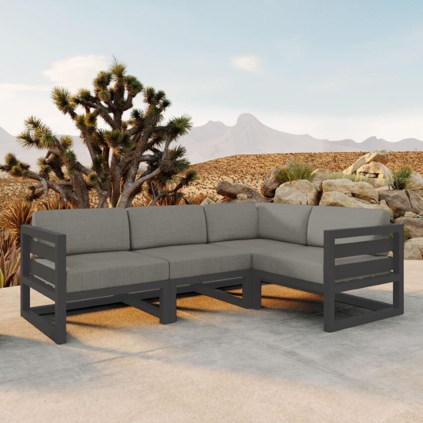 Misty Cove 4 Piece Sectional Set in Slate w/Canvas Charcoal Cushions by Lakeview - On Patio - Lifestyle thumbnail