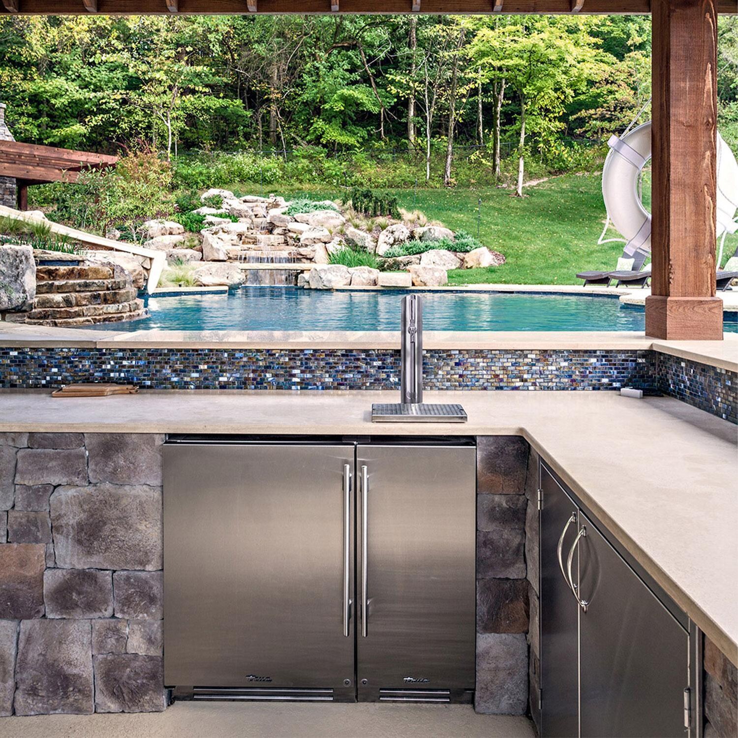 True TUIADA-15-LS-A~S ADA Height 15-Inch 75 Lb. Left Hinge Outdoor Ice Maker - Stainless Steel - By The Pool - Lifestyle thumbnail