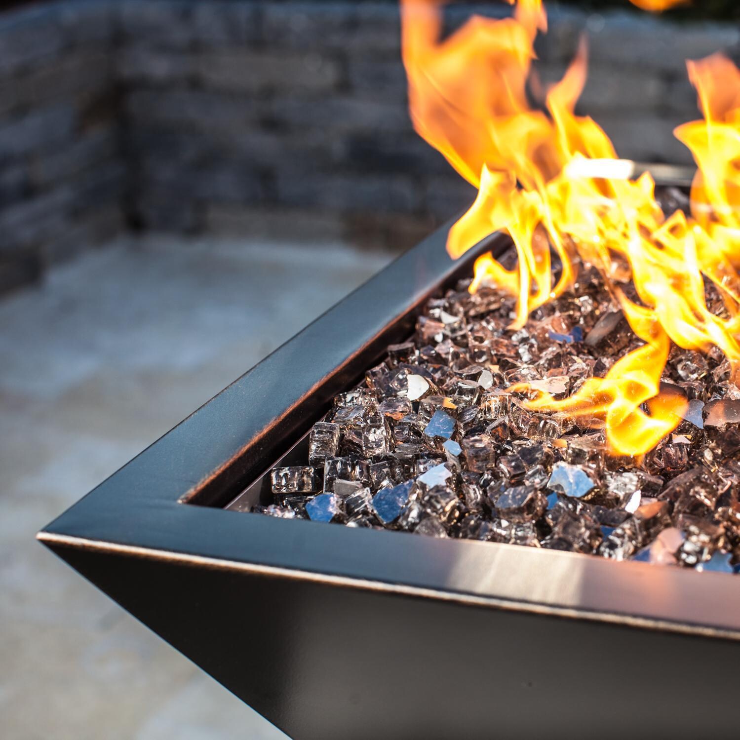 BBQGuys Signature Series Westfalen 24-Inch Square High-Rise Natural Gas Fire Bowl - Oil Rubbed Bronze - Corner Detail - Shown with 1/2 inch Monochrome Gray Reflective Fire Glass thumbnail