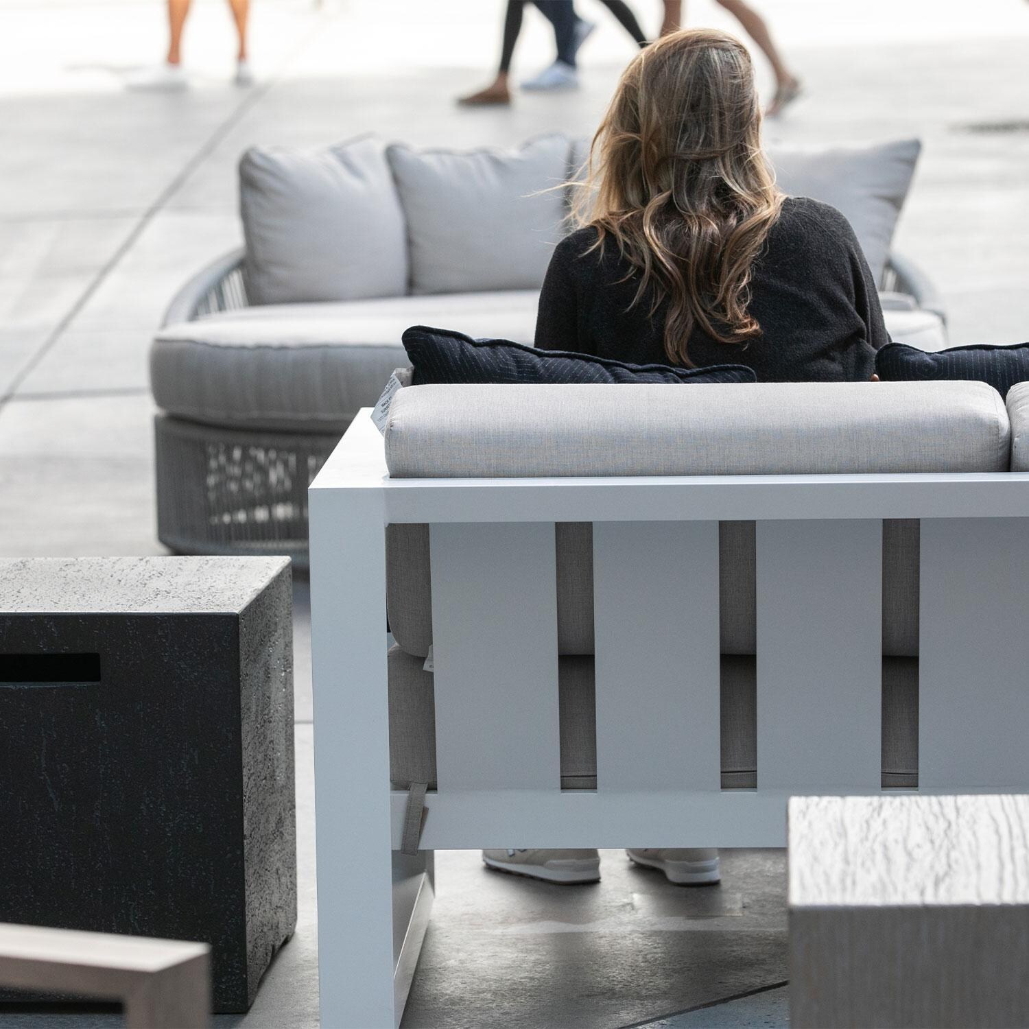 Newport Aluminum Patio Loveseat in Spectrum Indigo w/ No Welt by Sunset West - Patio - Rear View - Shown in Cast Silver Cushion Color finish - Lifestyle thumbnail