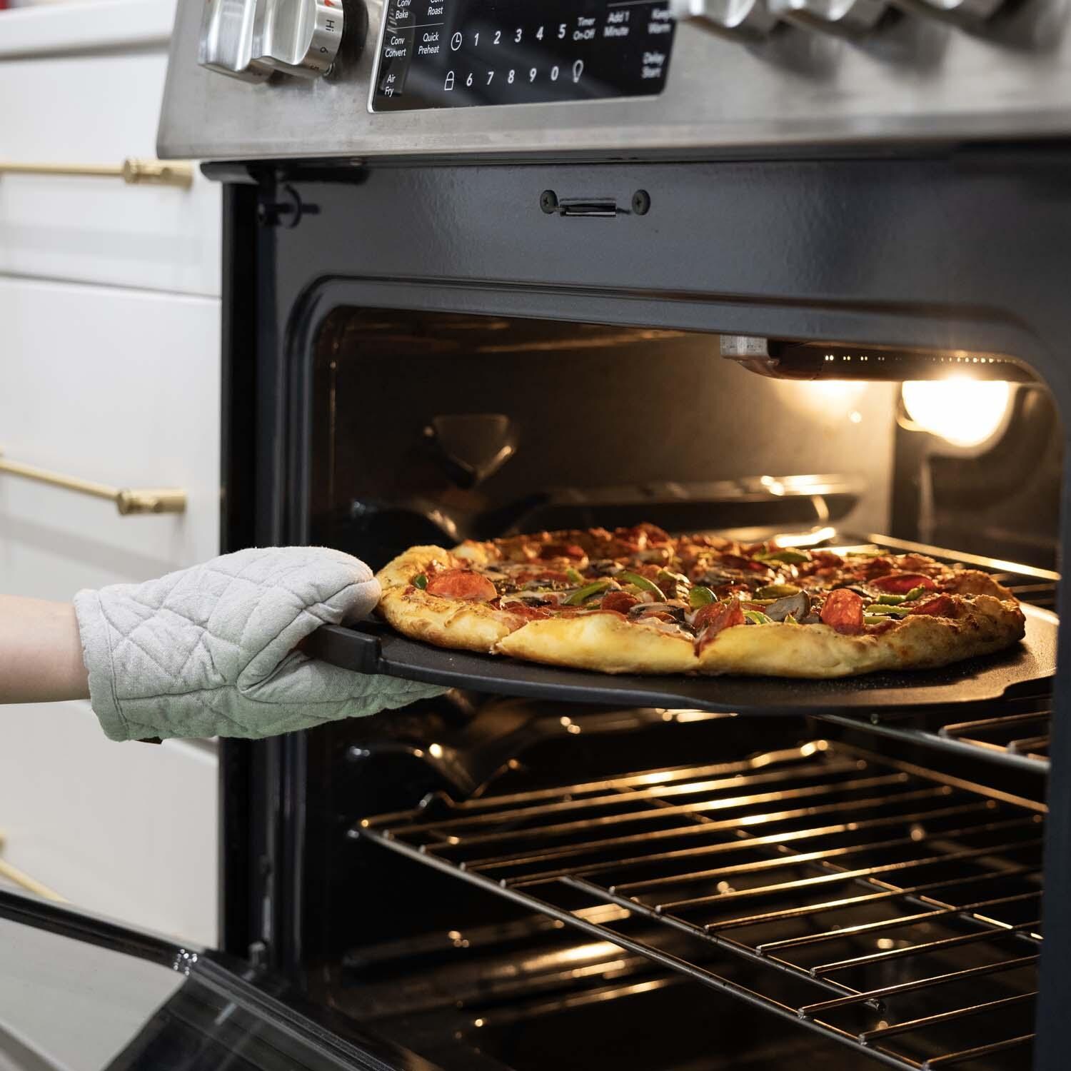 Outset 76597 Cast Iron Pizza Skillet Round - In Oven - Lifestyle thumbnail