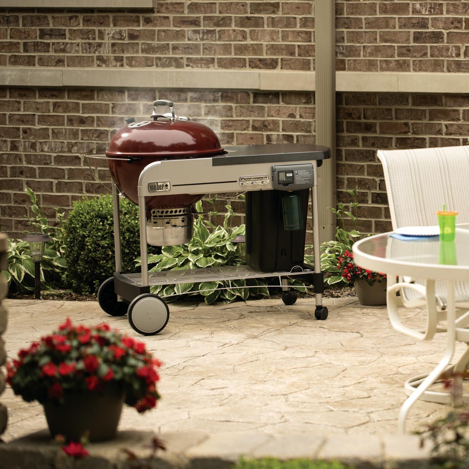 Weber Performer Deluxe 22 Inch Kettle Charcoal Grill On Cart - In Use thumbnail