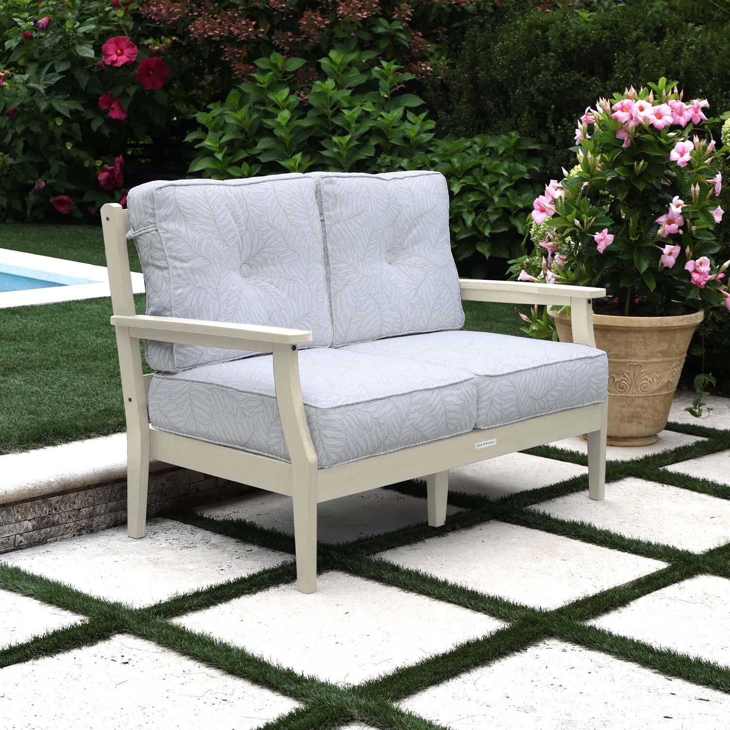 Blushing Bay 2 Person Recycled Plastic Loveseat in Lively Parchment/Whitewash by Lakeview Outdoor Designs - Left Angled - Lifestyle thumbnail