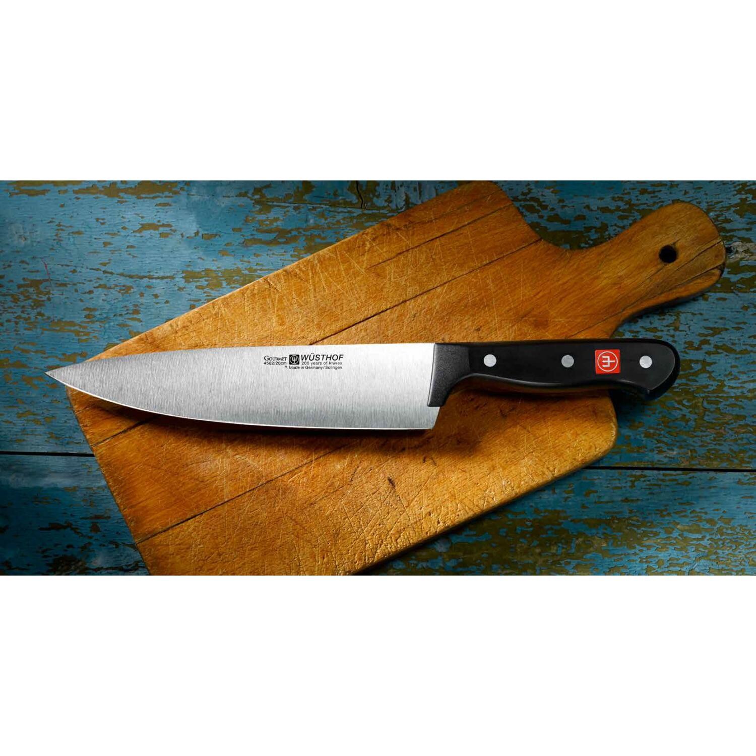Wusthof Gourmet 8-Inch Chefs Knife - On Cutting Board thumbnail