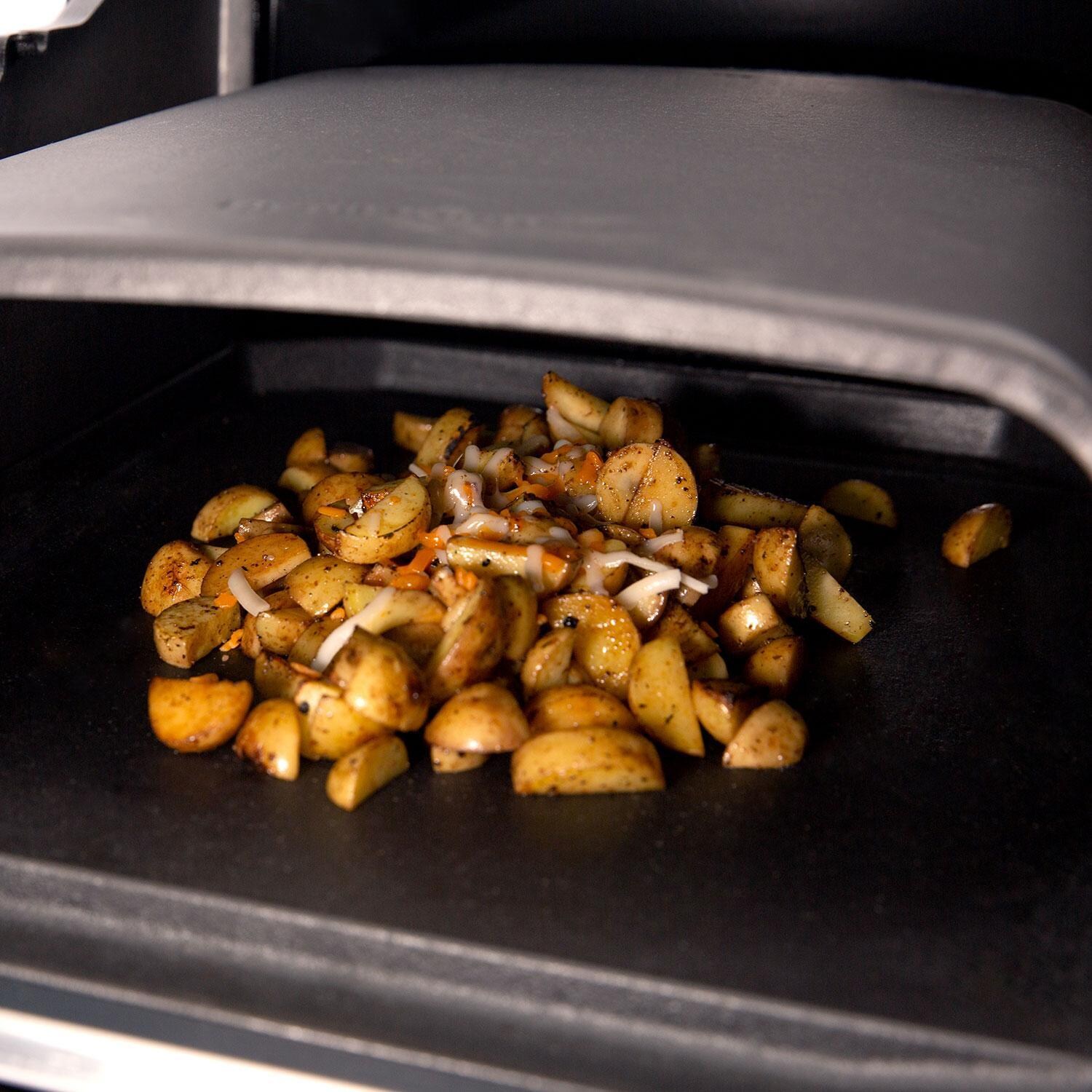 Broil King 69900 Cooking Dome - Cubed Potatoes on Grill - Lifestyle thumbnail