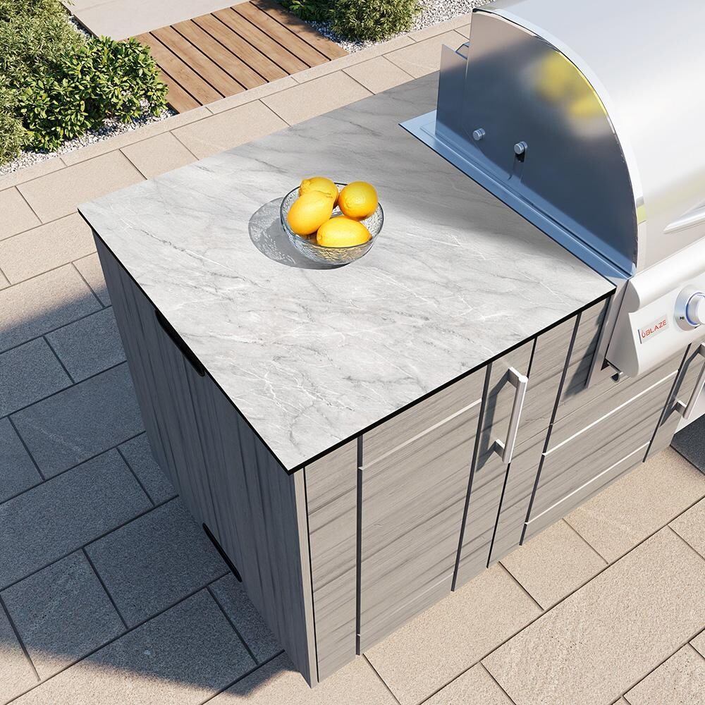 WeatherStrong Abaco 7 Ft Outdoor Kitchen Island w/ Blaze Propane Grill & Side Burner in Dark Ash/Glacier Frost - Countertop Finish - Lifestyle thumbnail