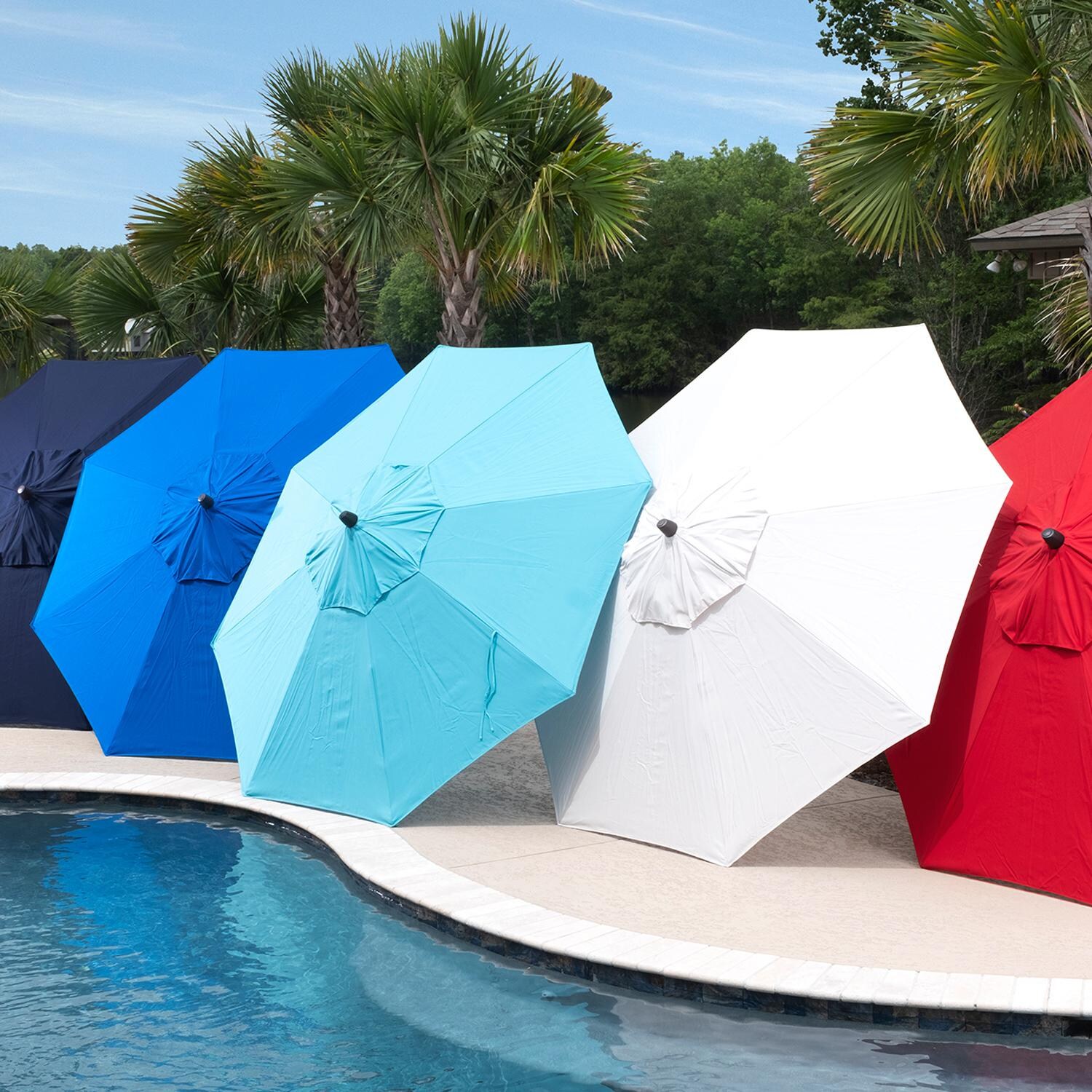 9 Ft. Octagonal Aluminum Auto Tilt Patio Umbrella W/ Crank Lift and Base By BBQGuys - Angled Poolside Lifestyle thumbnail