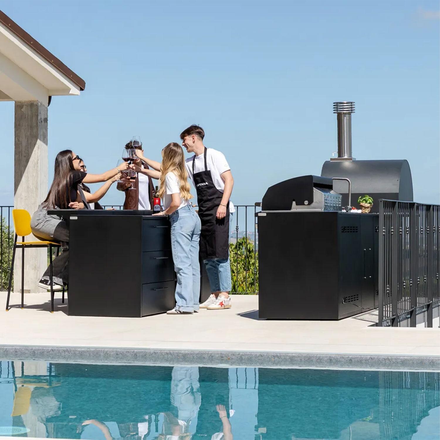 Fontana Forni Lynx Grill Cabinet W/ Iron Frost Countertop & End Panel - Cooking on Grill Attached to Cabinet - Side View - Lifestyle thumbnail
