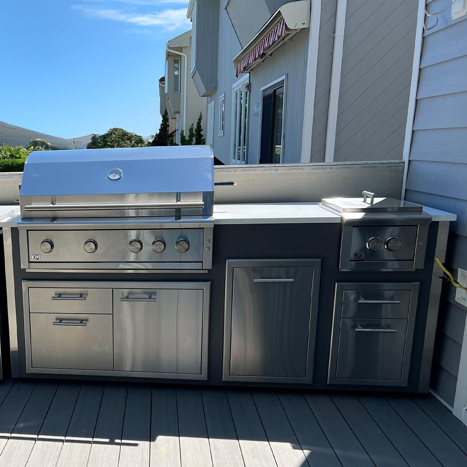 XO Designer 7 1/2 Ft Outdoor Kitchen Island w/ 42-in Natural Gas Pro-Grade Grill, Power Burner, Door & Drawer, Trash Drawer, & Double Drawer in Gray - Lifestyle thumbnail