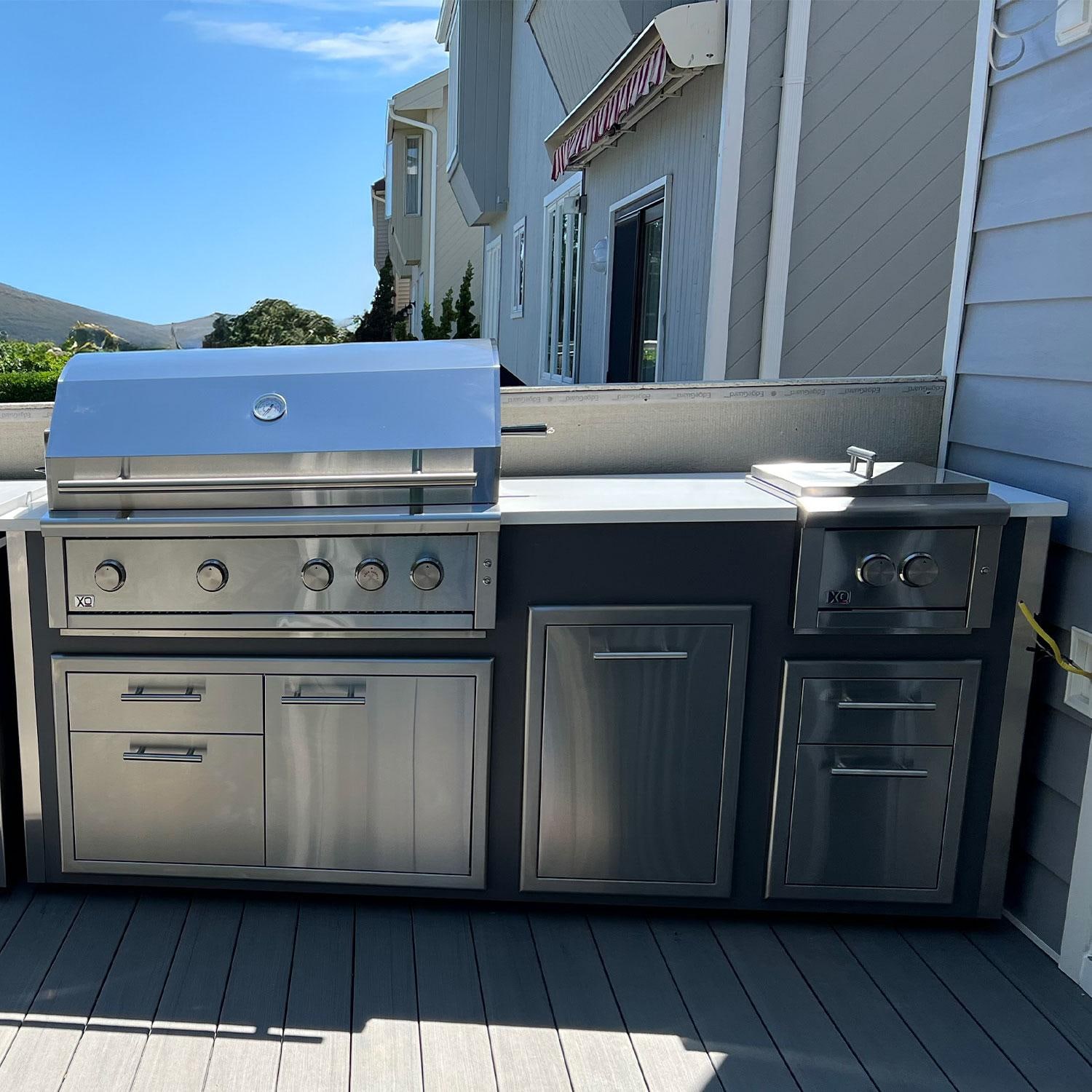 XO Designer 7 1/2 Ft Outdoor Kitchen Island w/ 42-in Natural Gas Pro-Grade Grill, Power Burner, Door & Drawer, Trash Drawer, & Double Drawer in Gray - Lifestyle thumbnail