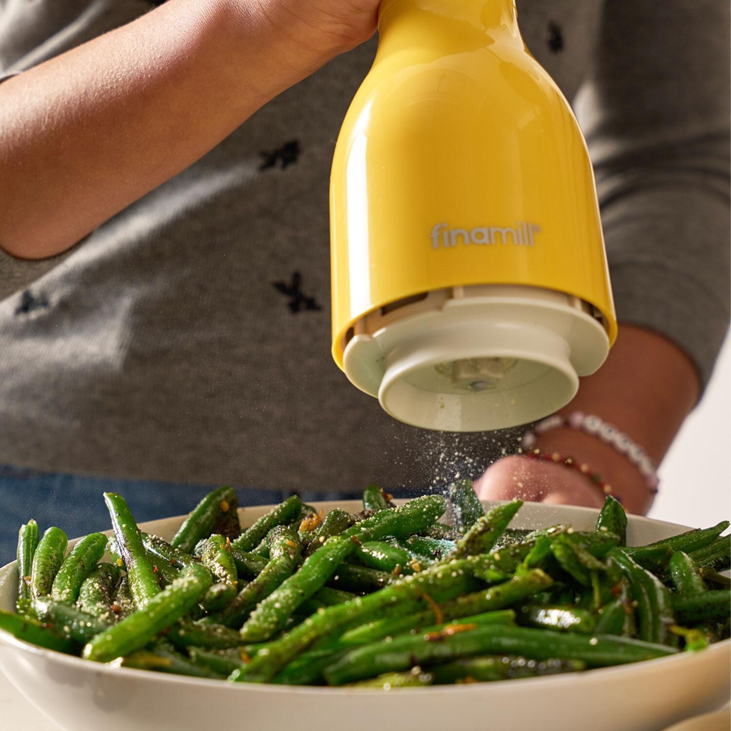 FinaMill GP803437-111CNY Classic Battery-Operated Spice Grinder in Canary w/ 1 Everyday Pod & 1 Peppercorn Pod - In Use - Lifestyle thumbnail