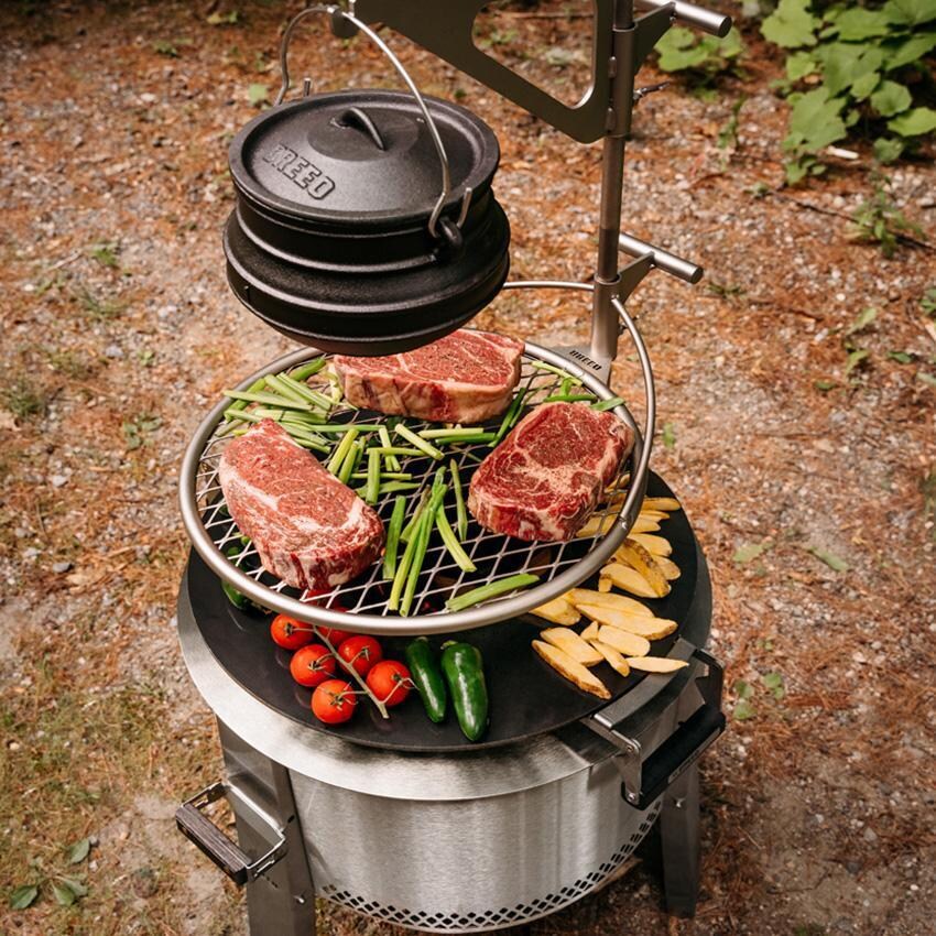 Breeo BR-YS-FMP Y Series Smokeless 19 Inch Round Stainless Steel Firemaster Fire Pit Bundle - Cooking in the Woods - Lifestyle thumbnail