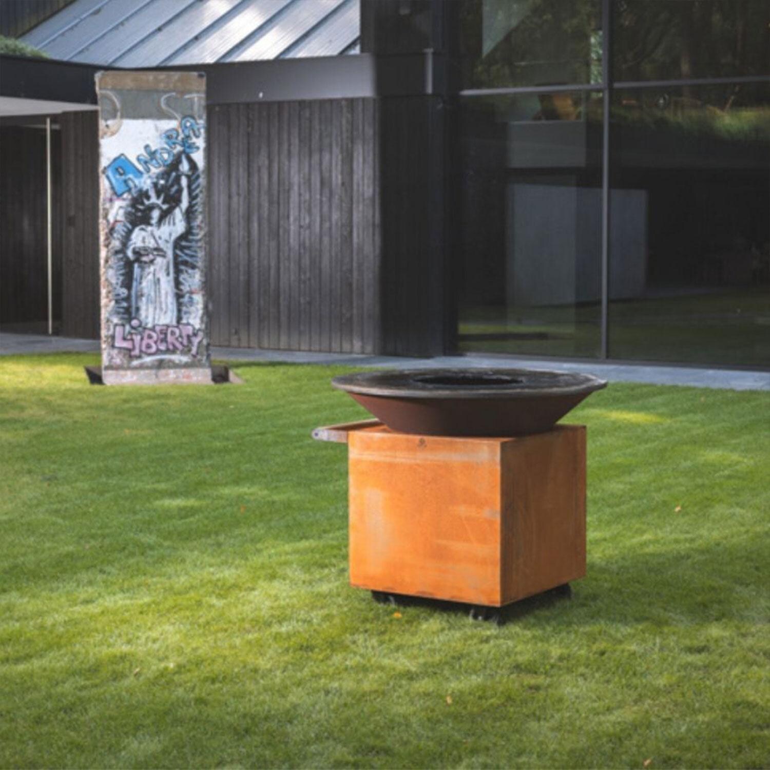 OFYR OC-120-PRO+ Classic Corten 120 PRO+ 46 Inch Wood-Fired Flat Top Grill - On Grass - Lifestyle thumbnail