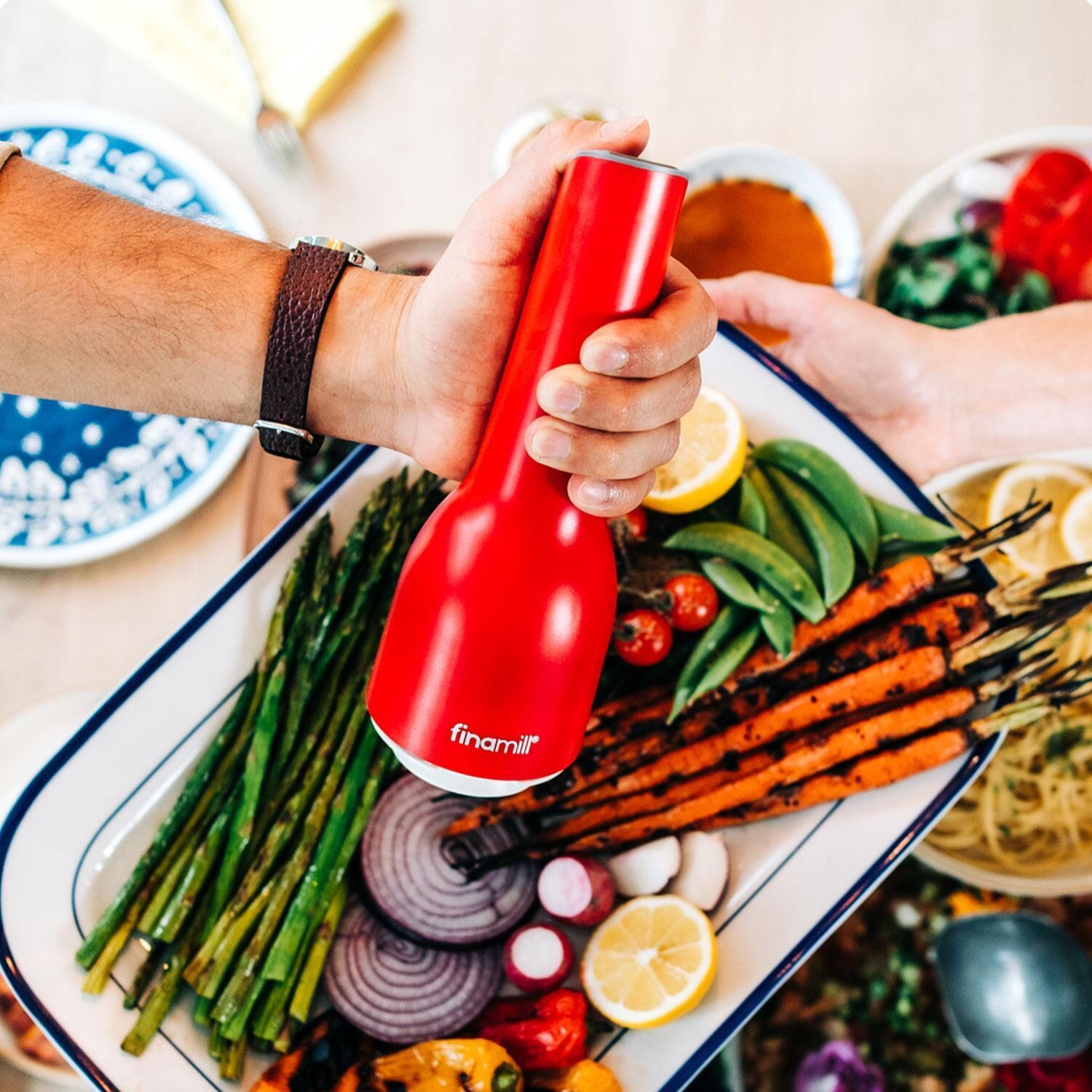 FinaMill GP813437-111SAN Classic Rechargeable Spice Grinder in Sangria w/ 1 Everyday Pod & 1 Peppercorn Pod - In Use - Lifestyle thumbnail