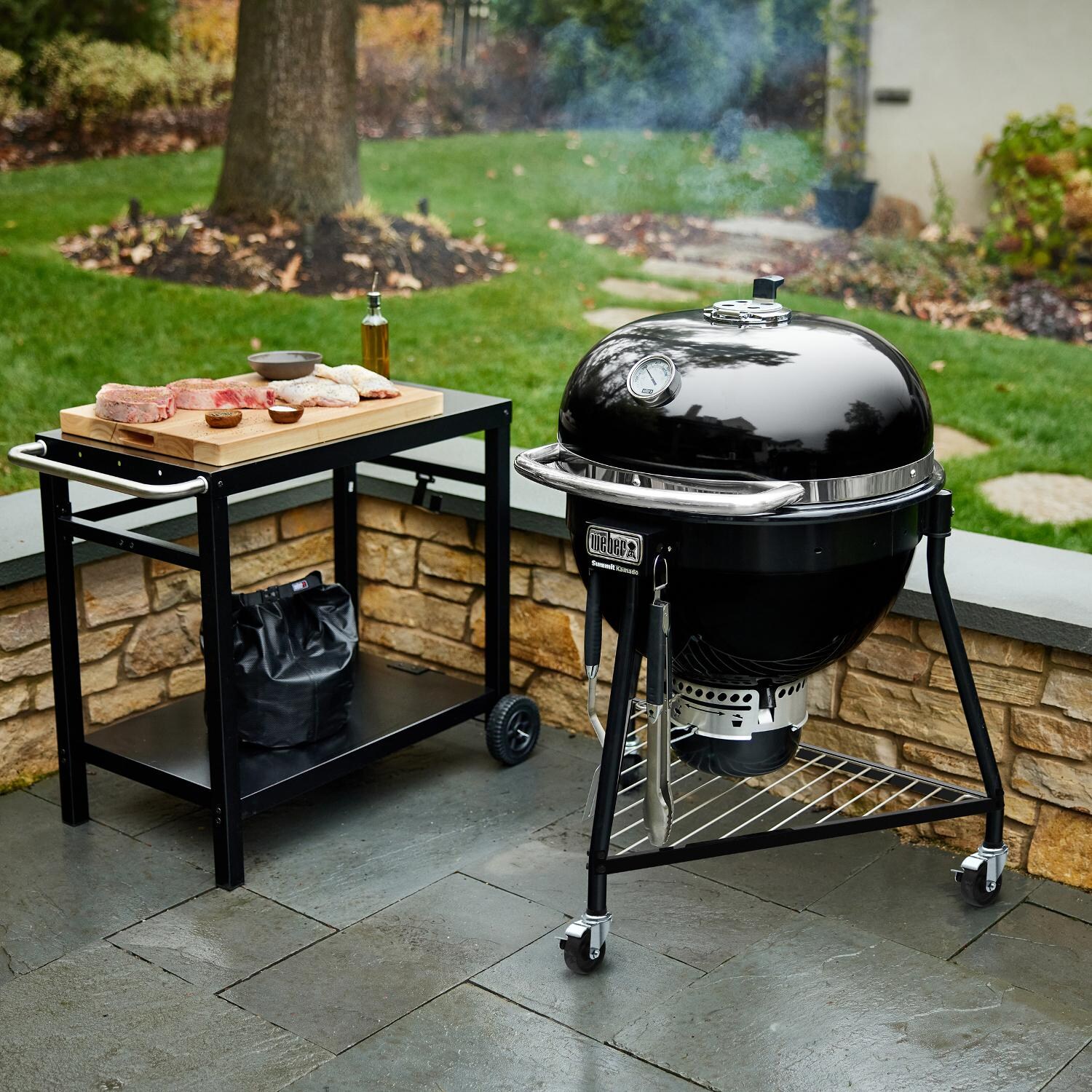 Weber - 18201001 - Summit 24-Inch Kamado E6 Charcoal Grill with Stand - Pre-heating Outside thumbnail
