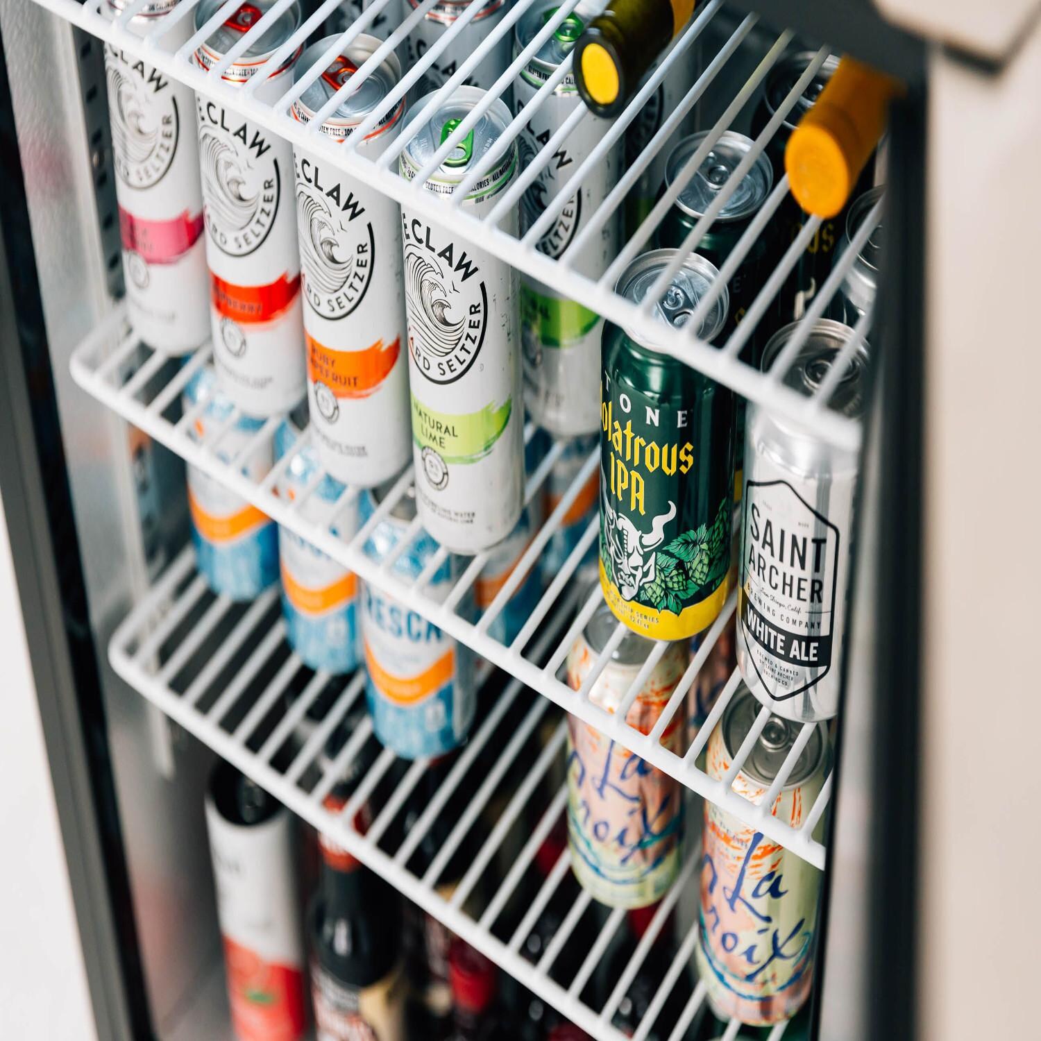 Summerset SSRFR-24D 24-Inch 5.3 Cu. Ft. Deluxe Right Hinge Outdoor Rated Compact Refrigerator - Angled with Drinks thumbnail