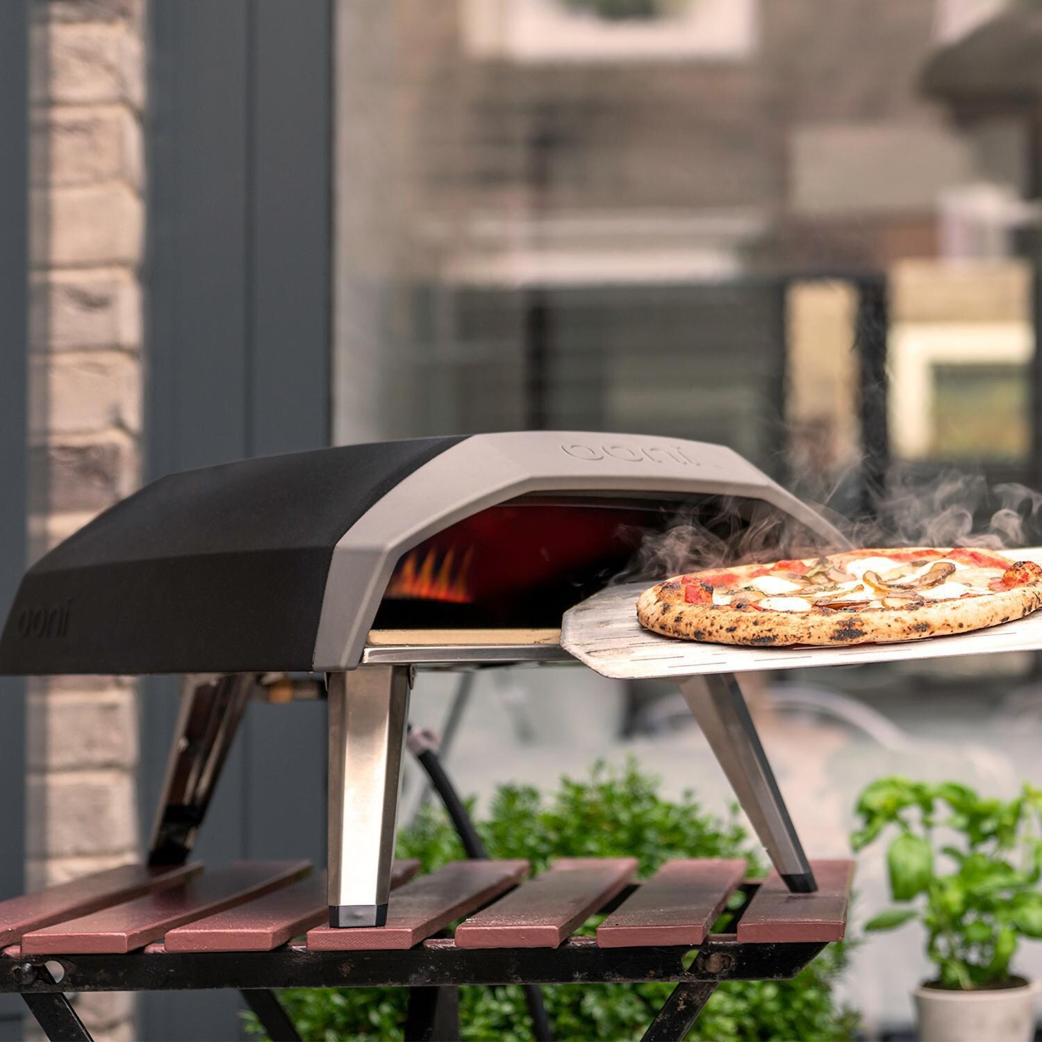 Ooni - UU-P06A00 - Koda Outdoor Portable Pizza Oven - Inserting Pizza thumbnail