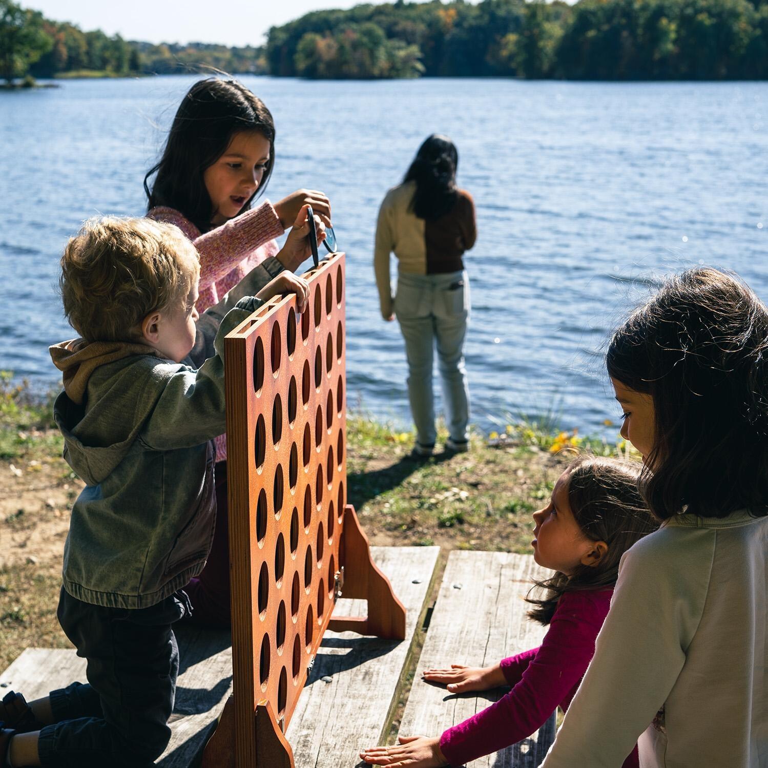Elakai EGG4-00 Giant 4 in a Row - Kids Playing by The Lake - Lifestyle thumbnail