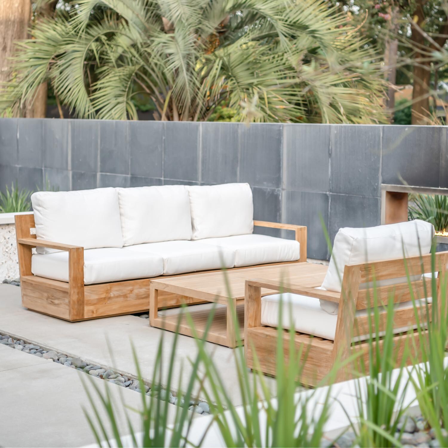 Teak + Table Atlantic Teak Patio Sofa in Sand - Natural cushions shown - Lifestyle thumbnail