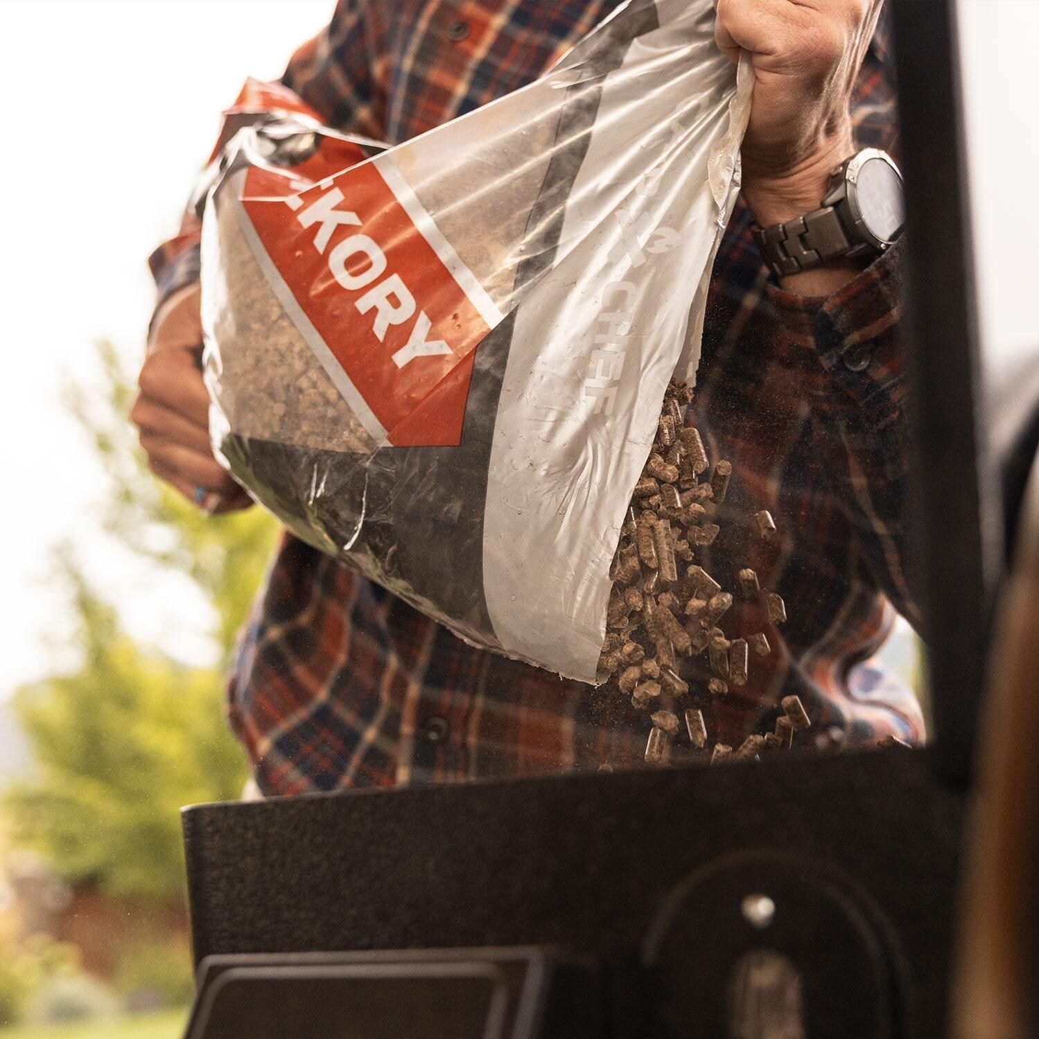 Camp Chef PG36SSG Woodwind SS 36 Pellet Grill - Pebbles Insert Into Hopper - Lifestyle thumbnail