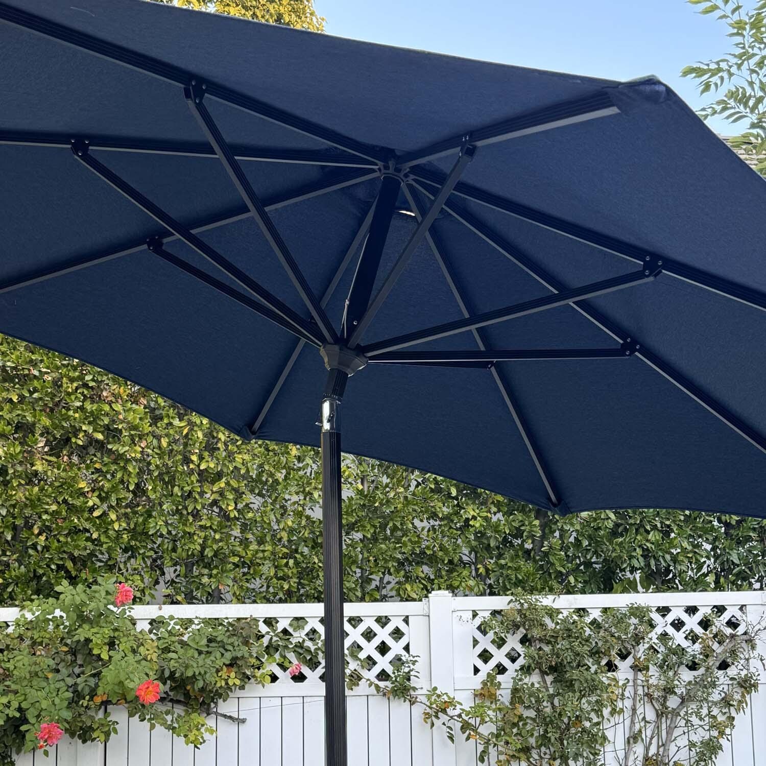 9-foot navy patio umbrella WESTLAKE 9 Ft Solar LED Umbrella, Beige resistant polyester canopy for outdoor use Product Details Canopy Material At Home Navy Blue Outdoor