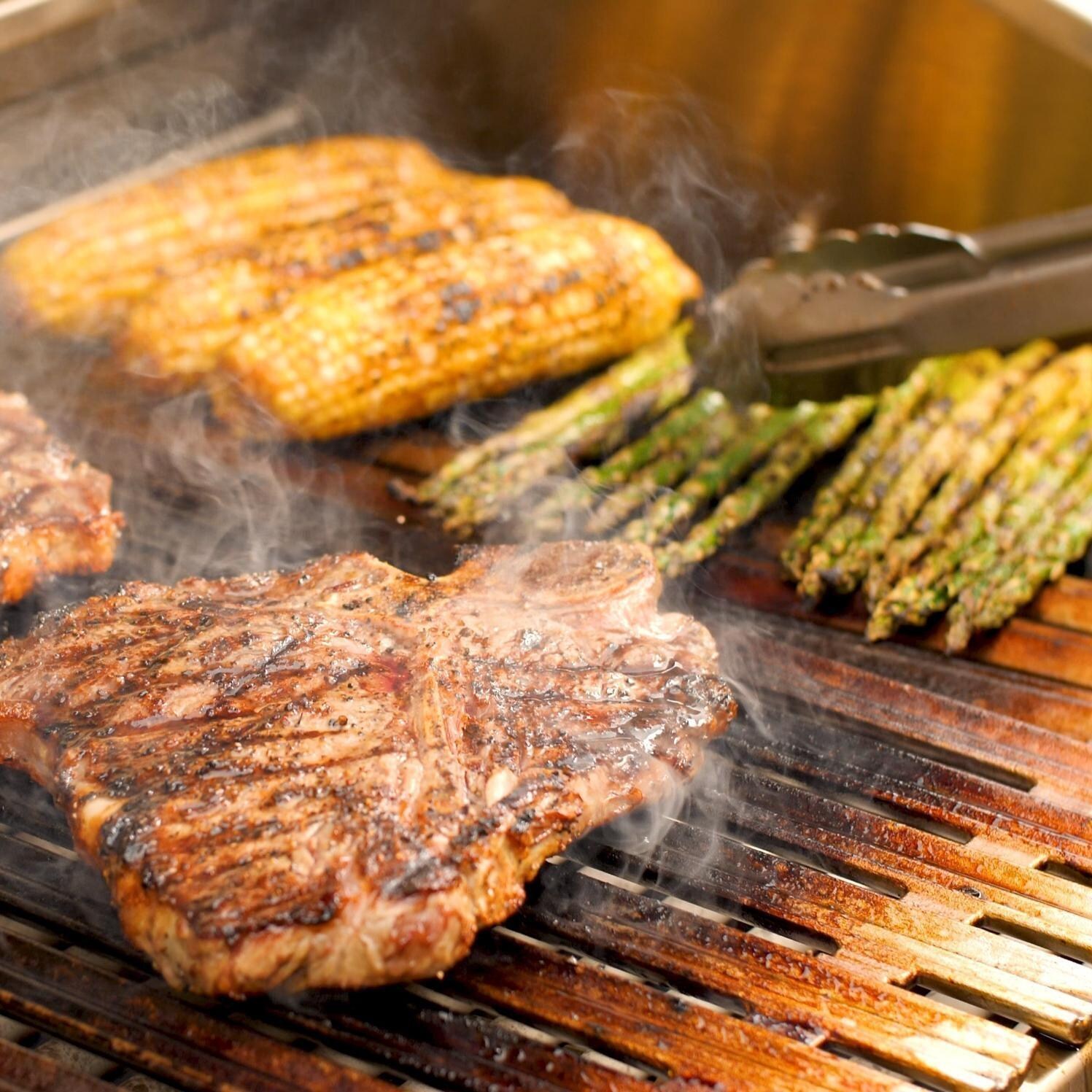 DCS BE1-48C-N Series 9 48 Inch 4 Burner Built-In Natural Gas Grill w/ Charcoal Smoker Box - Grilling Pork Chop, Corn on the Kob, & Asparagus - Lifestyle thumbnail