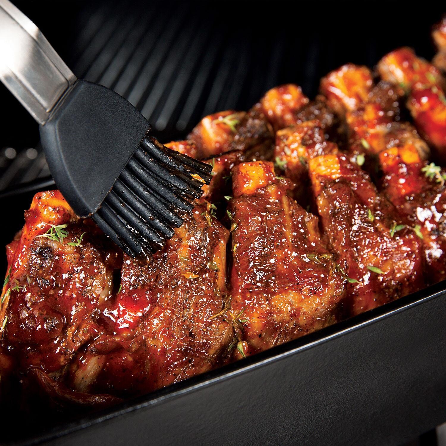 Broil King 69615 Cast Iron Rib Roaster - Rubbing BBQ Sauce - Lifestyle thumbnail