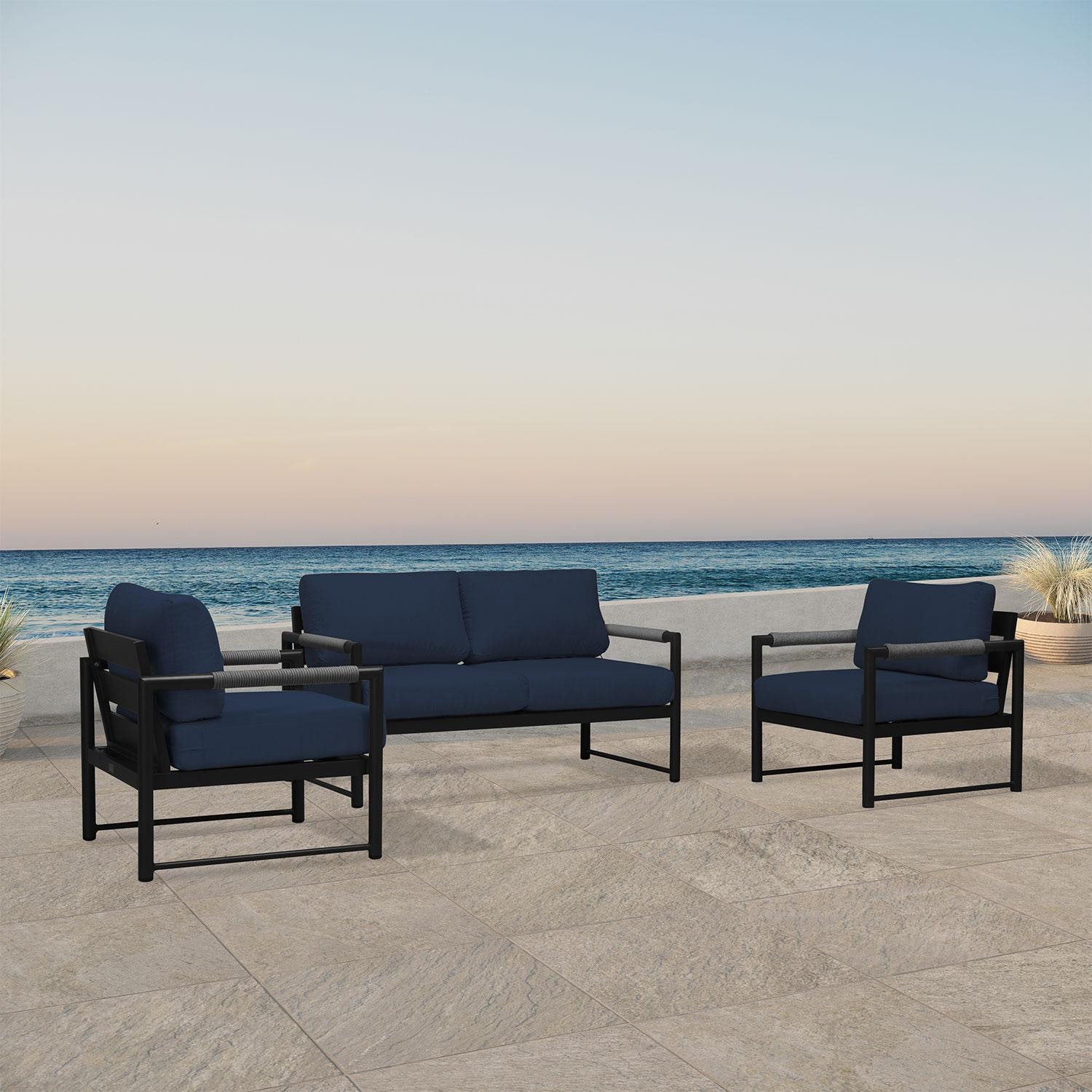 Lakeview AVEBAY-BK-CO-SET120-IN Avenue Bay Black/Carbon 3 Pc Loveseat Set - Spectrum Indigo - Angled On Patio - Lifestyle thumbnail