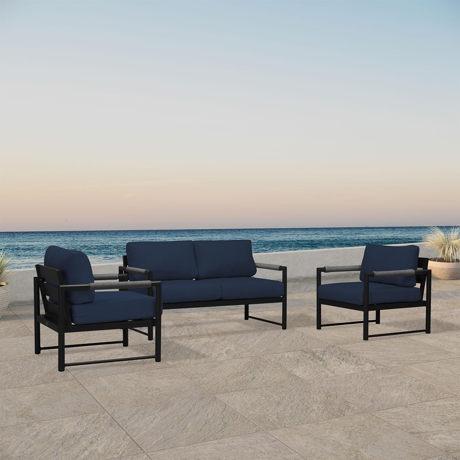 Lakeview AVEBAY-BK-CO-SET120-IN Avenue Bay Black/Carbon 3 Pc Loveseat Set - Spectrum Indigo - Angled On Patio - Lifestyle thumbnail