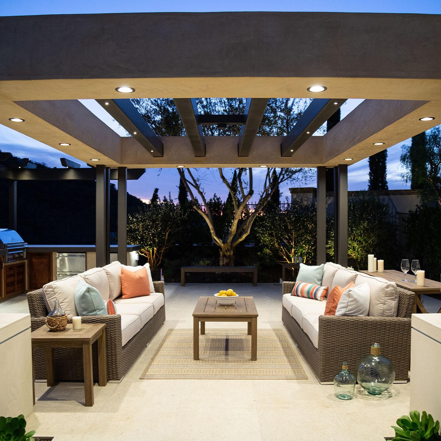 Coronado Wicker Patio Sofa W/ Sunbrella Canvas Flax Cushions By Sunset West - Two Loveseats in Back Patio (Only One Included) - Lifestyle thumbnail