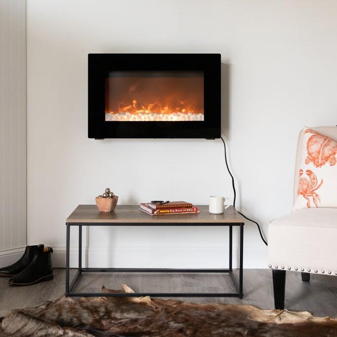 Fire Sense 31-Inch Wall Mount Electric Fireplace - Black - 60757 - Lifestyle with Rocks thumbnail