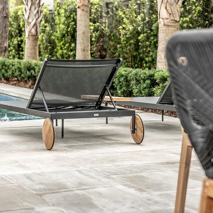 Teak + Table St Barts Aluminum Chaise Lounge in Black - Side Table View - Lifestyle thumbnail