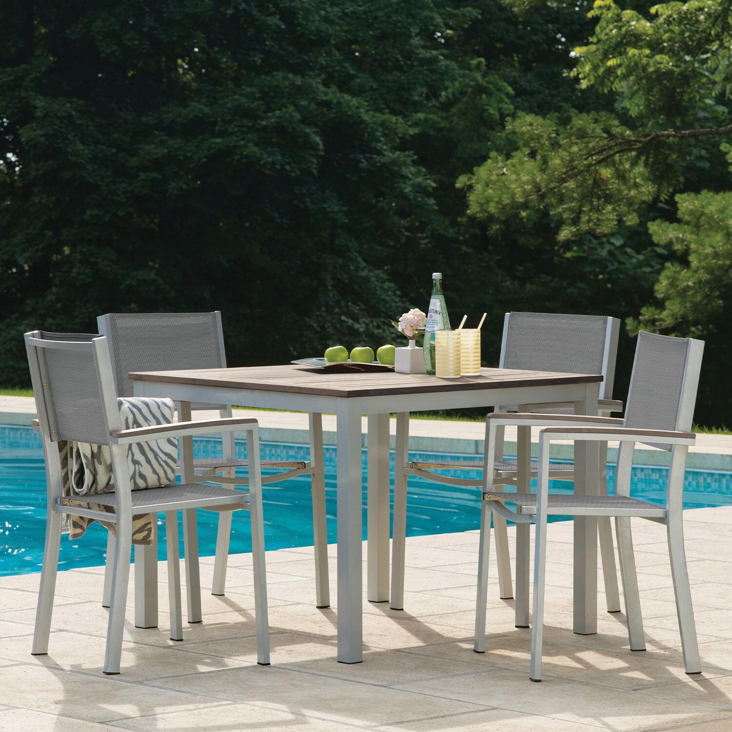 Travira 5 Pc Powder-Coated Aluminum Dining Set W/ Square Table in Titanium by Oxford Garden - By The Pool - Lifestyle thumbnail