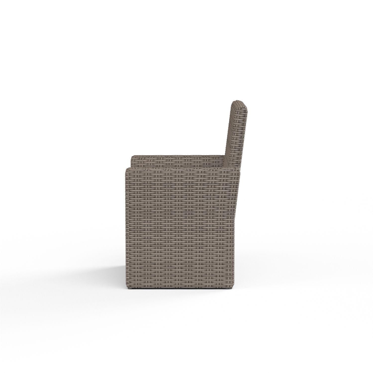 Coronado Wicker Patio Dining Arm Chair W/ Sunbrella Canvas Flax Cushion By Sunset West - Side View - White Background thumbnail