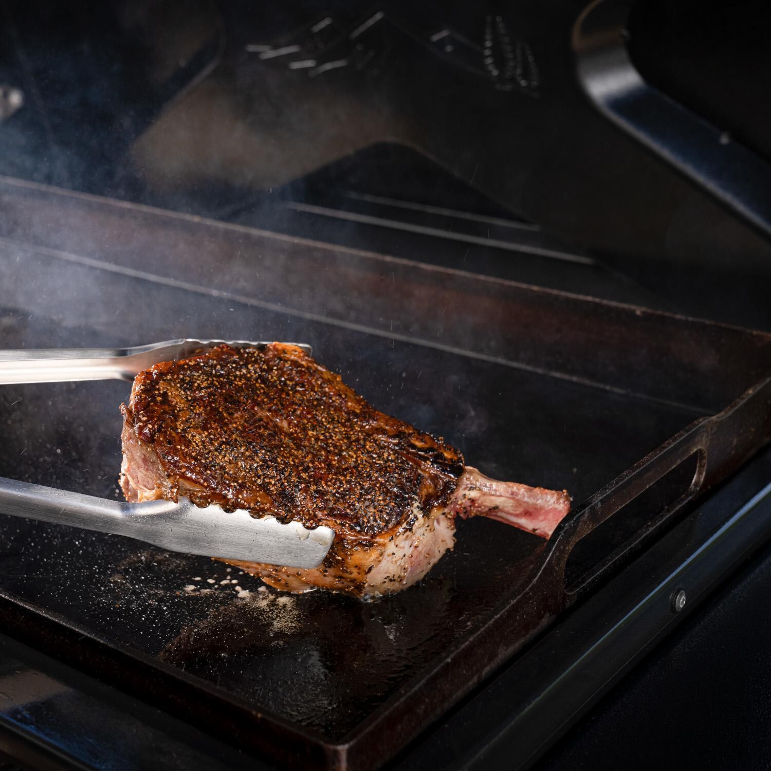Traeger TF3CN59AU Flatrock Flat Top Grill - Griddle Detail With Steak - Lifestyle thumbnail